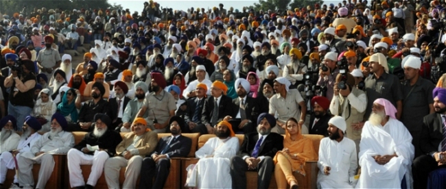 Badal Family and  various BJP politicians in VIP area on sofas in front row, representatives  of Nihang Dals and Sant Deras can bee seen sitting on plastic chairs in  the back rows