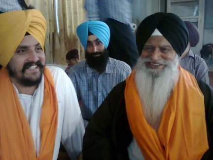 Dhunda smiling with Ex-communicated Ragi Darshan