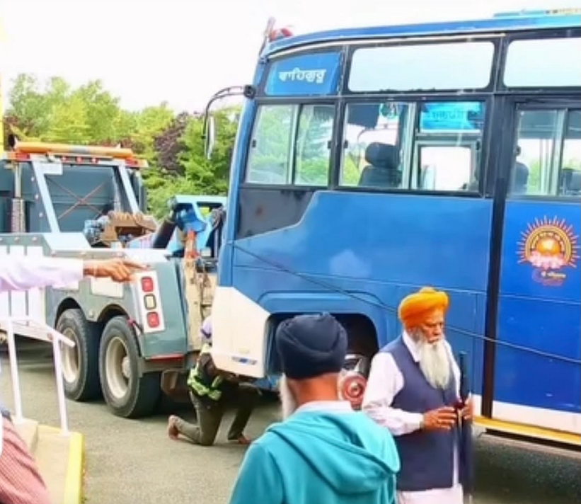Dilapidated SGPC Bus Being Towed From Vancouver Port with Sacred 225 Saroops